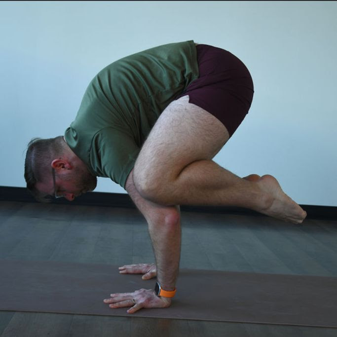 Jeremiah Elliot practices bakasana