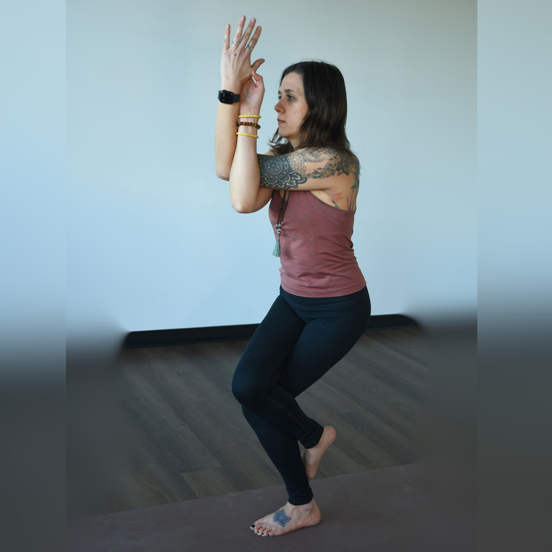 Jordan Nommay practices garudasana