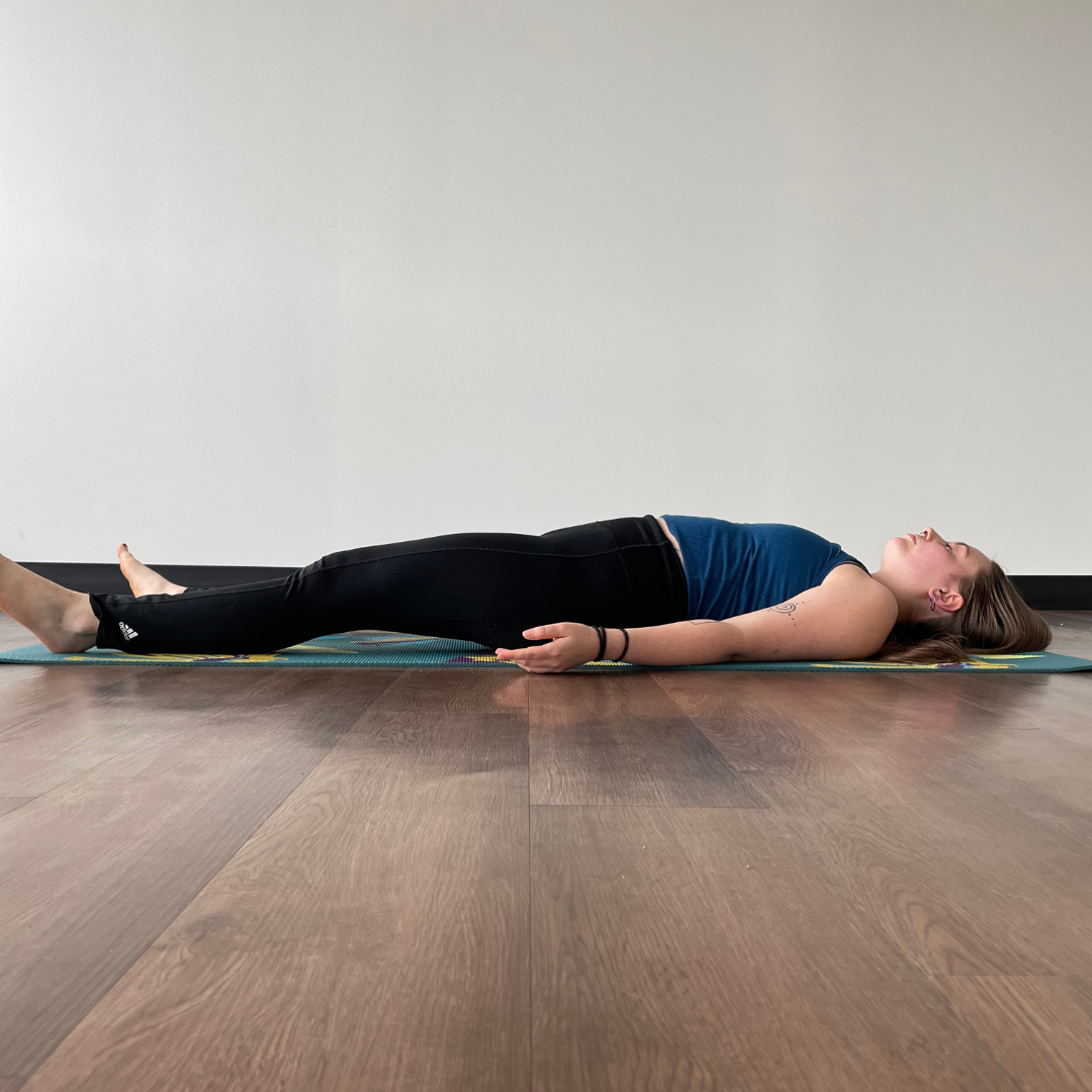 Zoe Lowden practices savasana