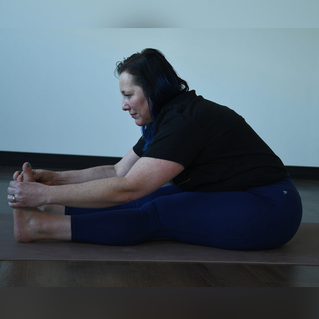 Kati Black practices paschimotanasana