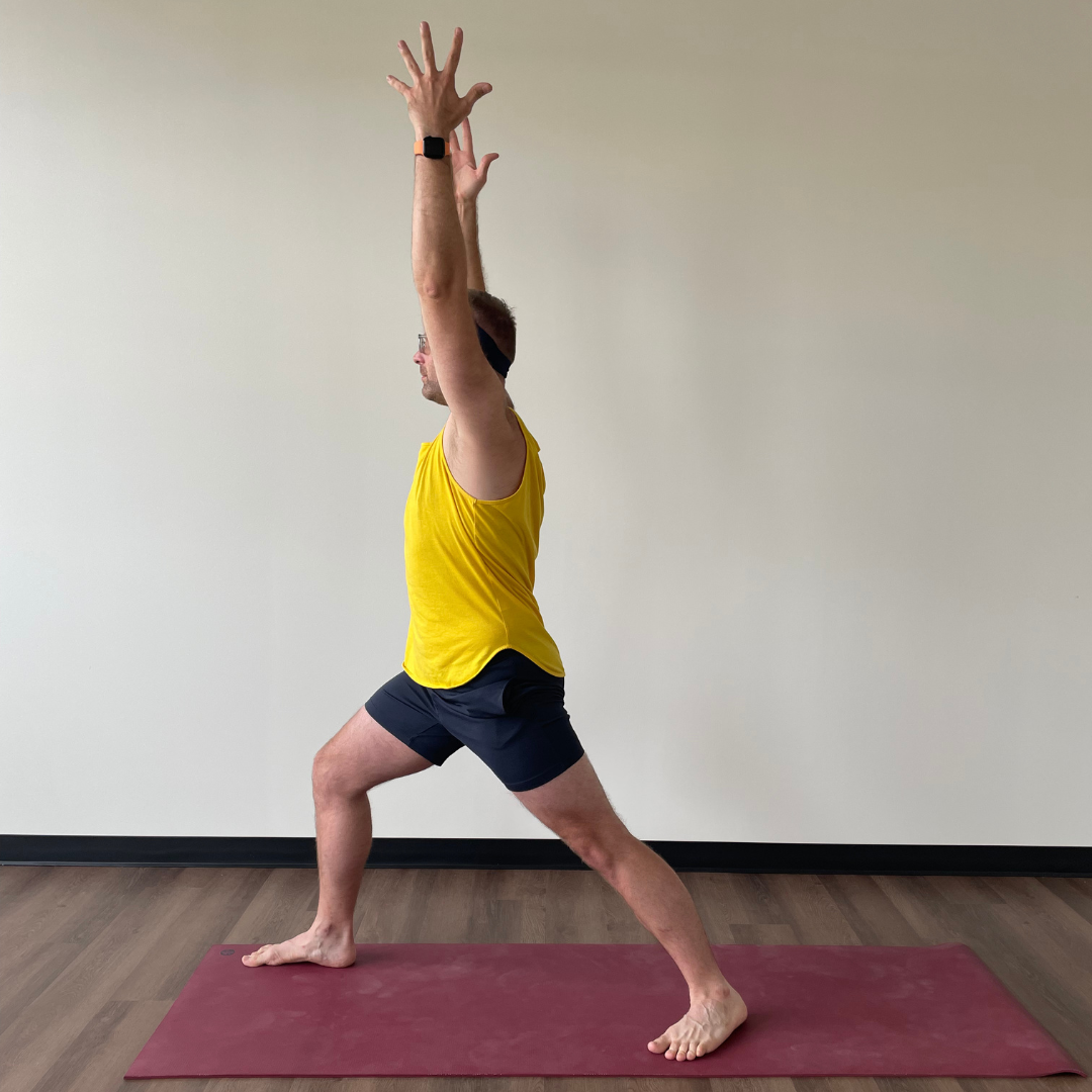 Jeremiah Elliot practices virabhadrasana I