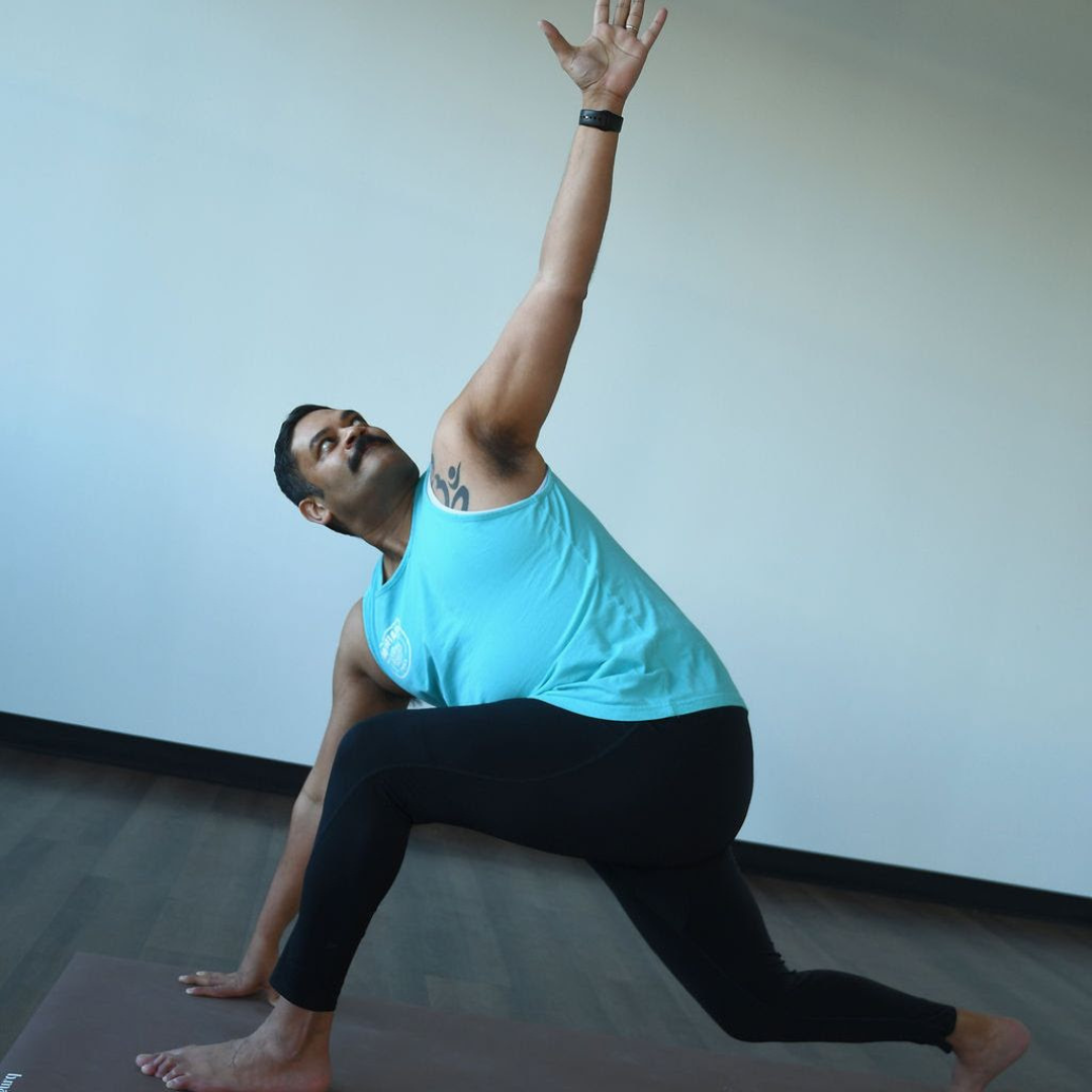 parivrtta anjaneayasana Ganesh Sharma practices prarivrtta anjaneyasana