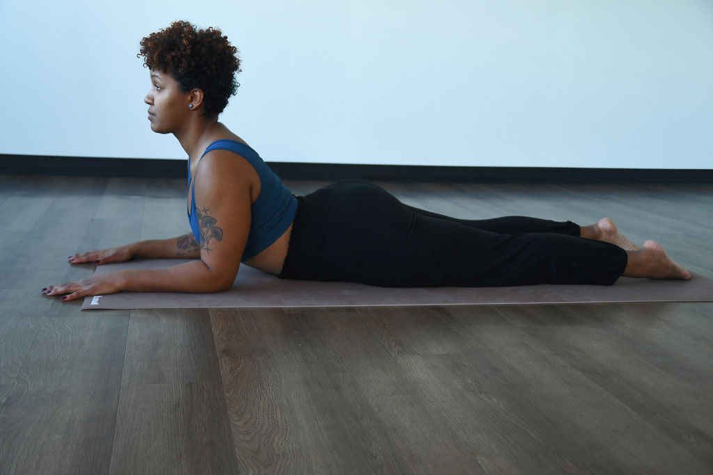 Ariela McKenzie practices salamba bhujangasana