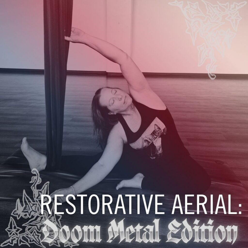 Kati Black demonstrates janusirsasana with the aerial silk. Resotrative Aerial: Doom Metal Edition